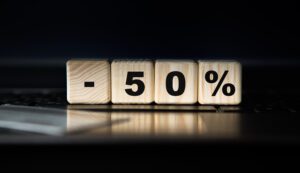 wood cube with percentage to down arrow symbol interest rate stocks ranking mortgage loss concept